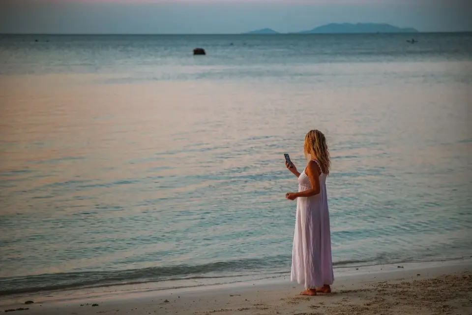 wait for a call, taking photos, woman, blond