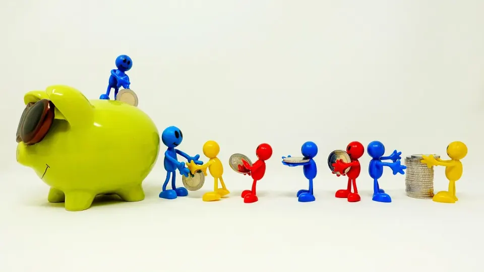 A piggy bank with coins, a symbol of the savings from dropping a monthly insurance charge