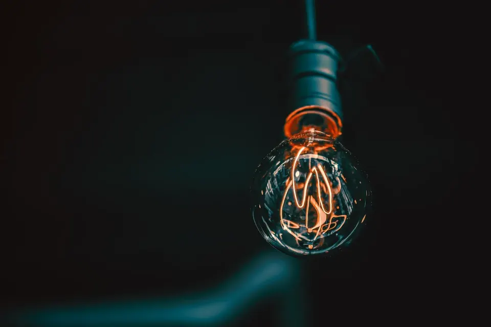 A glowing light bulb, a symbol of electricity use at home